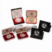 A collection of six silver proof coins issued during the 1970s for various nations and territorie...