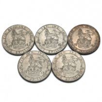 A group of five sterling silver one shillings coins minted in the years 1914-1918 forming a date ...