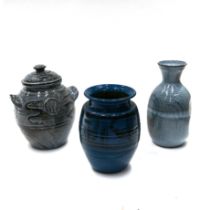 Three items of Cricklade pottery, to include 2 vases and a lidded pot, all in a blue colour. Part...