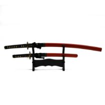 A Japanese Katana, or Samurai sword, and a smaller Wakizashi, both with scabbards and mounted on ...