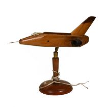 A novelty 1950's wooden lamp in the form of a Jet Aeroplane. A shaped shade on either side would
...