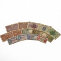 An assortment of Commonwealth banknotes from the reigns of King George VI and Elizabeth II to inc...