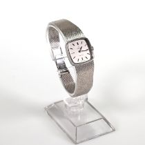 Omega, a lady’s 9 carat white gold bracelet watch, square silver dial with batons, black hands, t...
