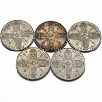 A group of five sterling silver two shillings florin coins making a date run 1914-1918, the years...