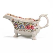 A good Bow famille rose pattern footed sauceboat, circa 1750. Hand painted over glaze floral desi...