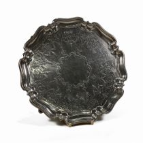 A silver salver, H. Atkin, Sheffield 1911, of circular shaped outline with moulded rim, engraved ...