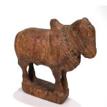 A carved 20th century hard wood Indian Nandi bull. H 26cm, L 24cm, D 8cm.