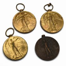 A collection of four WWI Victory Medals issued in 1919 following the First World War engraved as ...