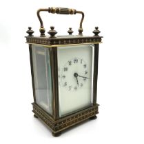 19th Century French brass carriage clock with key. H 13cm, W 7.5cm.