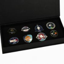 An Omega Speedmaster 50th Anniversary boxed pin badge set, comprising eight different badges to i...