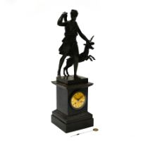 French Empire mantle clock, circa 1810, in bronze with a figure of Diana the huntress and a stag....