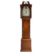 An oak long case clock, circa 1800, with eight day movement, striking the hour to a bell. White d...