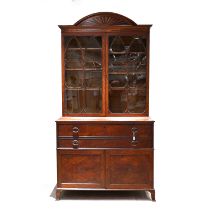 Regency Satinwood bookcase in the manner of Gillows. Upper glazed doors with adjustable shelves w...