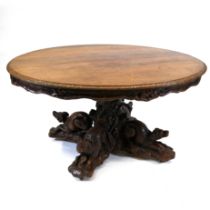 A large Black Forest Hunt Centre Table, c1880s. Constructed in Oak the base has been carved as fo...