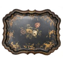 A large early Victorian papier mâché tray decorated with a still life of flowers  to the centre s...
