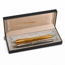 Two Parker Sonnet pens with 18K 750 nibs. The first in "Cascade Gold" pattern, the second of simi...
