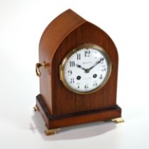 A late 19th Century Lancet shaped mantle clock in mahogany case supported on brass bracket feet a...