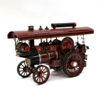 A scratch built showman's traction engine in maroon - total length 65cm, maximum height (funnel l...