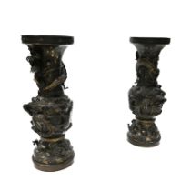 A large pair of Japanese Meiji period bronze vases, each splitting in to three sections with the ...