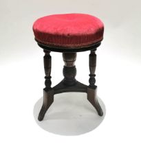 An Aesthetic Period adjustable Mahogany Piano Stool. With upholstered seat and turned spindles, t...