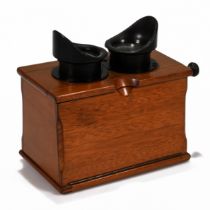 A Unis of France Standard Stereoscope in Walnut case with bakelite eye pieces c1920s. Retailers p...