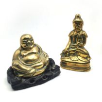 Two brass Buddha's. The first a 19th Century polished brass Buddha seated in the Bhumisparsha mud...