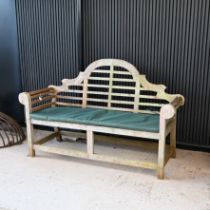 A Teak Lutyens style garden bench, with cushion and cover. W 164cm, D 56cm, H 106cm.