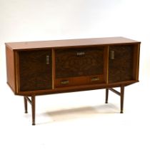 A vintage Formica drinks cabinet sideboard on legs. Two outer cupboards with central drop down dr...