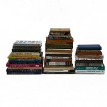 A collection of fishing related books to include "Cowardians Go Fishing", "Salmon Fishing" by Ric...