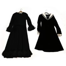 A black velvet Sailor style dress and a Nettie Vogues black dress with feather detail (2). Both c...