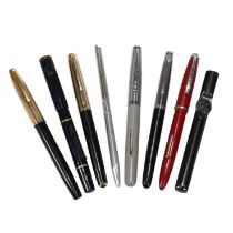 A small collection of pens to include a Sheaffer White Dot with 14K gold nib, a Swan "self-filler...