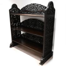 A large late 19th Century Anglo Burmese bookcase or rack. Decorated with pierced and carved decor...