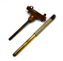 A mid 19th Century Naval telescope together with a mid 19th Century walnut telescope rest for hol...