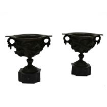 A pair of 19th Century Grand Tour bronze two handled drinking cups mounted on square marble socle...