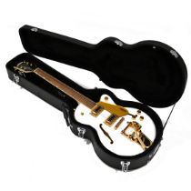 A Gretsch electromatic Bigsby Snowcrest guitar, in a Gretsch case.