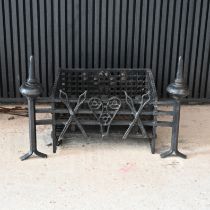 A large 20th century wrought iron fire basket in a port cullis pattern approximately 80cm wide an...