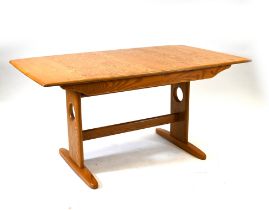 An Ercol Windsor (model 1193) light Elm 6-8 seater extending dining table. W 92cm, H 73cm, L 150c...