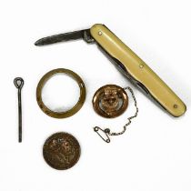 Small collectibles to include a brass ferret muzzle, a gold plated brooch in the form of a belt b...