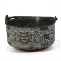 A bronze or copper hanging pot with intricate chase-work design depicting dragons, dolphins, Celt...