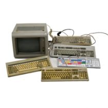 An IBM 5151 monochrome Monitor c1983 together with IBM keyboards (4) and a logic keyboard (1). No...