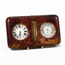 A travelling desk set, comprising a Goliath watch, a similar barometer, in a leather case with a ...