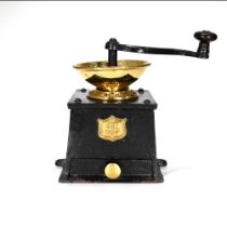 A late 19th Century coffee grinder with case iron body and polished brass bowl. Made by J&J Siddo...
