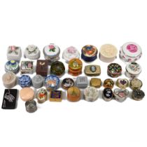 A collection of 35 pill boxes of various forms and materials to include Royal Doulton, Stratton a...