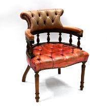 A leather clad "Captain's" style chair, of mahogany frame with turned legs to the front an sabre ...