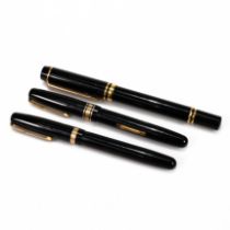 A three compartment leather Waterman's pen case containing three Waterman's pens: a French made W...