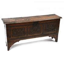 A late 17th Century and later Oak 6 plank coffer with carved decoration to the front. Staple - hi...