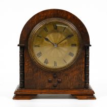 A small circa 1930's French platform escapement mantle clock retailed by Kemp Brothers of Bristol...