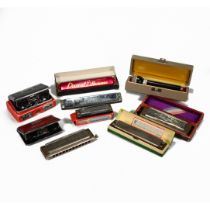 A small collection of harmonicas to include Horner "The Super Chromonica", along with folding ope...