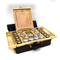 A lady's travelling vanity case, by Drew & Sons of Piccadilly, with 27 glass containers with whit...