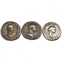 Group of three (3) late 1st and early 2nd century AD Roman silver Denarii of Trajan and Domitian....